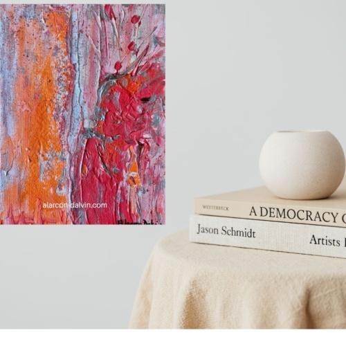 un tableau abstrait orange clair et vif reliefs argent décoration intérieure créé par l'artiste peintre ALARCON DALVIN pour un petit espace un tableau très lumineux