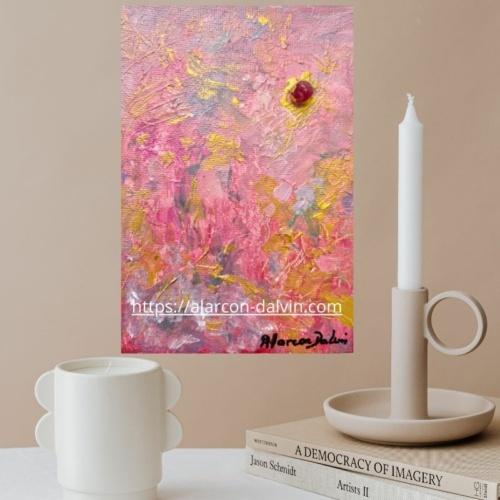 Zoom sur la texture de la peinture et l’agate rose incrustée, révélant les détails et le relief de l’œuvre